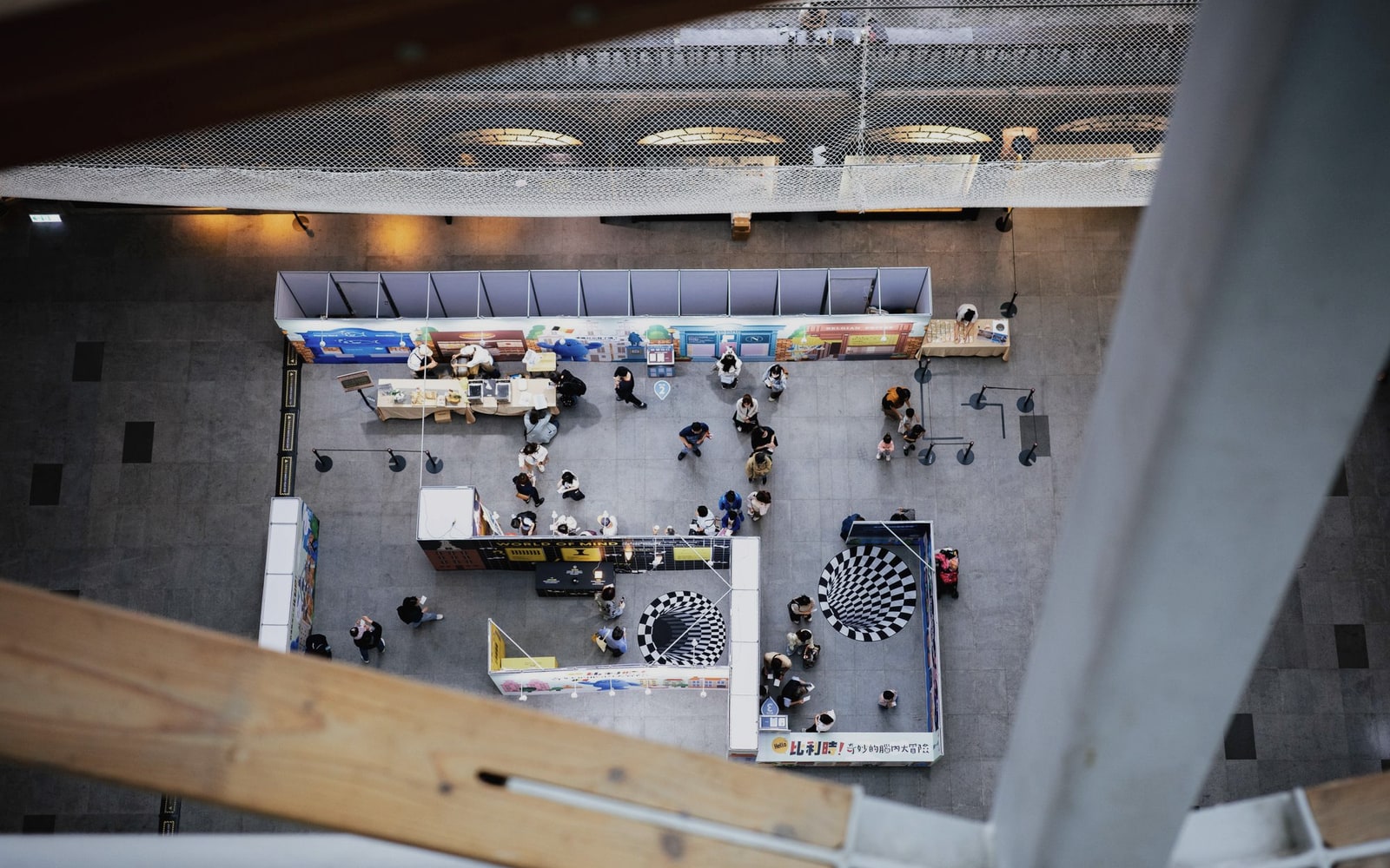 Overhead view of businesses meeting across an exhibition floor