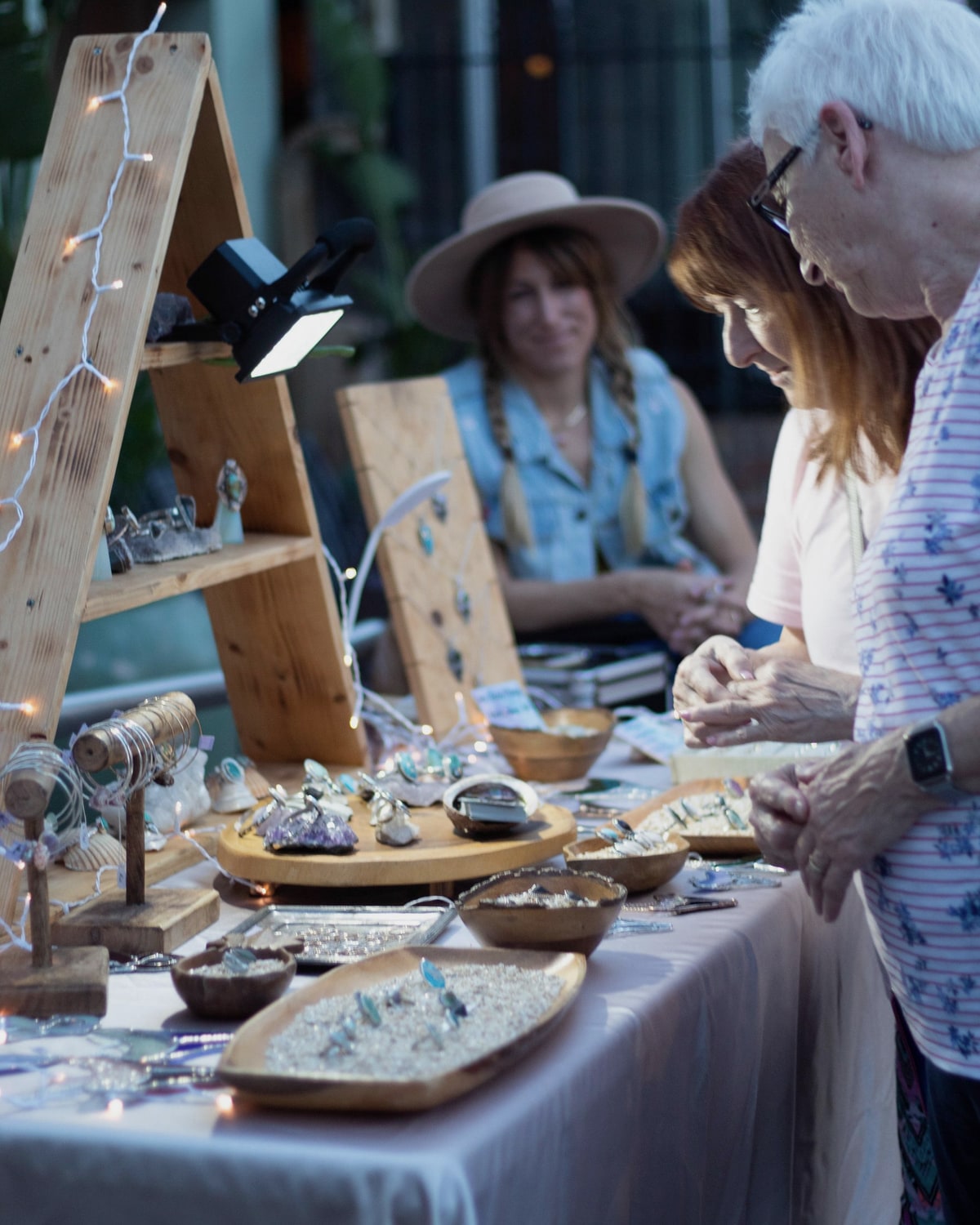 Visitors examining products at an exhibition stand